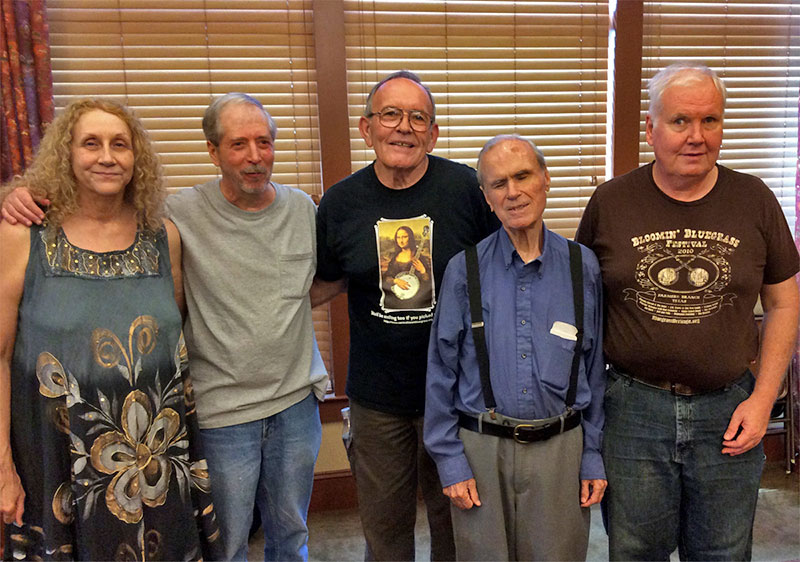 Texas a la Moag - Picture Of Rod Moag with lots of guitars and mandolins