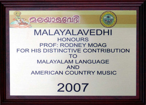 Plaque reads: Malayalavedhi Honors Prof Rodney Moag for his distinctive contribution to Malayalam Language and American Country Music, 2007